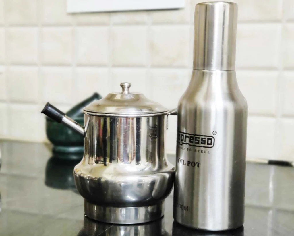 plastic free kitchen- oil stored in stainless steel bottles